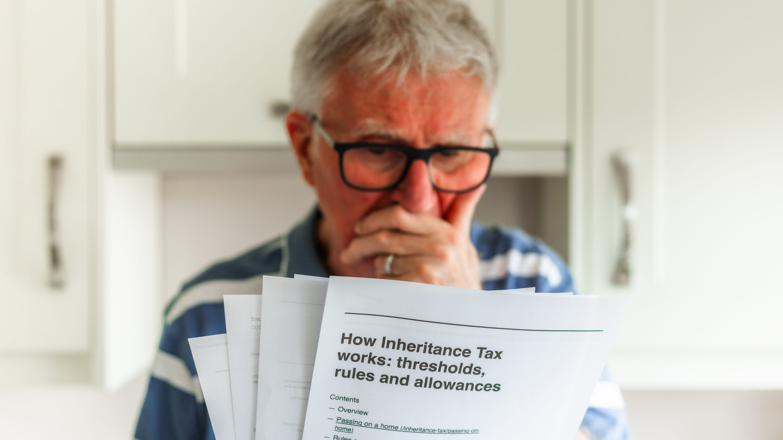 GettyImages 2170338615 scaled uai -Worried senior man looking at inheritance tax documents | Piercefield Oliver